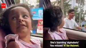 Road Safety Awareness: Little girl questions biker for not wearing helmet; adorable road safety video goes viral