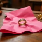 Why are gold ornaments sold wrapped in pink paper?