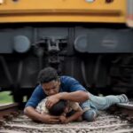 Man Saves Son From Train: Viral: Man leaps onto railway track to save son as train passes overhead