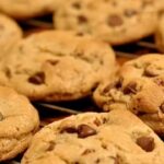In 1938, Ruth Wakefield’s simple choice of mixed chopped chocolate into cookie dough created America’s favorite dessert.