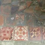 A biscuit tin secret comes to light as a former thief returns medieval tiles after sixty years.